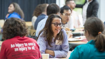 new faculty members chat during orientation